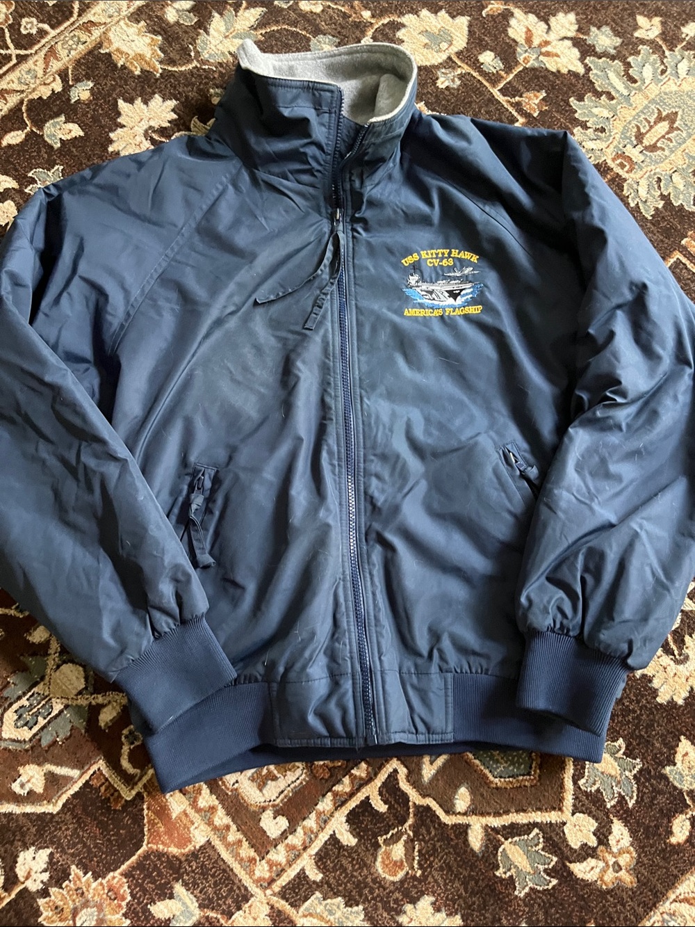 Navy USS KITTY HAWK Embroidered Bomber Jacket with fleece interior.